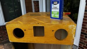 Wiping the cabinet down with naphtha